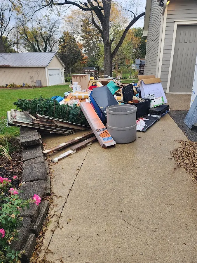 Dumpster being loaded with debris for Roofing Dumpster Rental in West Whiteland